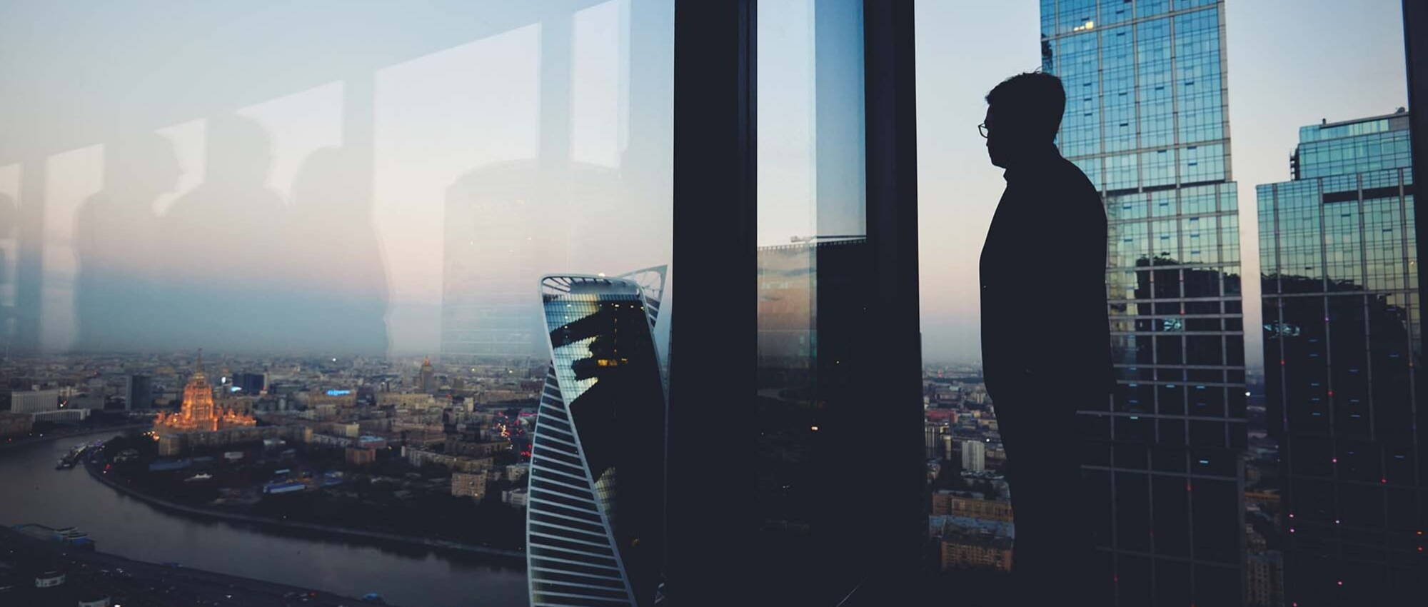 Man looking through window