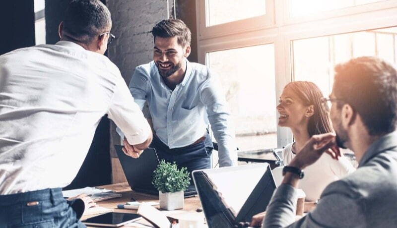 Candidate shaking hand of HR Manager after getting hired